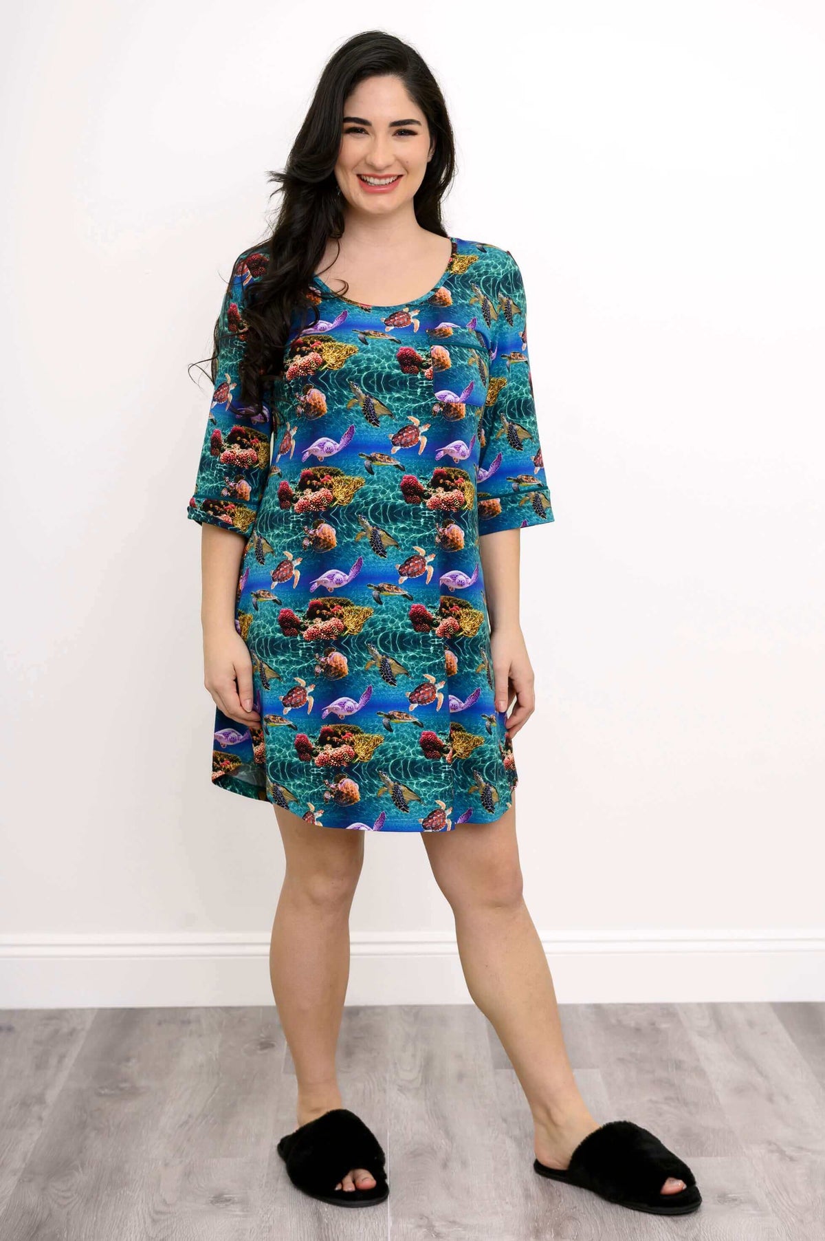 Woman smiling in a coral reef bamboo sleepshirt with 3/4 sleeves, front pose