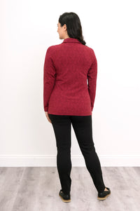 Back view of a red patterned bamboo knit jacket, showcasing clean vertical seams and a straight back hemline.