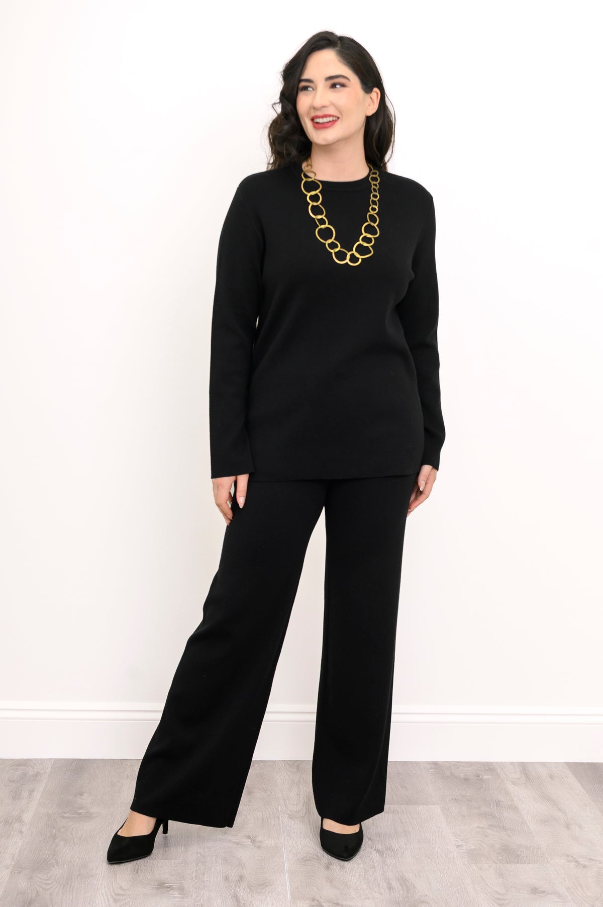 Front view of a women's ebony pullover sweater paired with comfortable fluid lounge pants, relaxed silhouette.