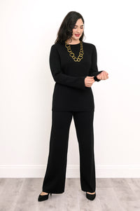 Front view of a women's ebony-colored rectangular knit top, showing a comfortable, loose-fitting drape.