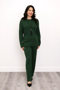 Front view of an elegant all-green knit matching set, highlighting a comfortable, body-skimming drape on a model.