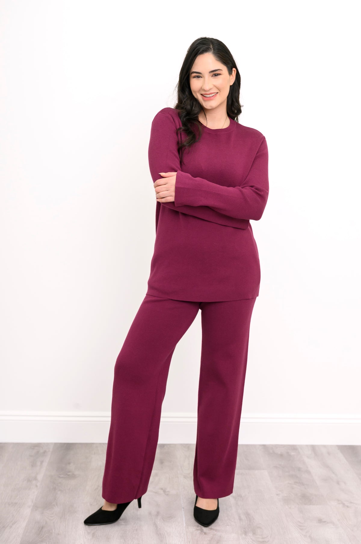 Front view of an elegant maroon knit matching set, highlighting a comfortable, body-skimming drape on a model.