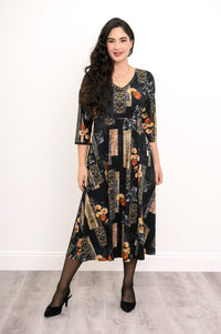 Front view of a women's black and orange floral bamboo midi dress, highlighting a relaxed, comfortable fit.