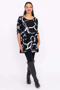 Spirit A-Line Dress shown from front, modeled with black leggings and boots, features scoop neckline