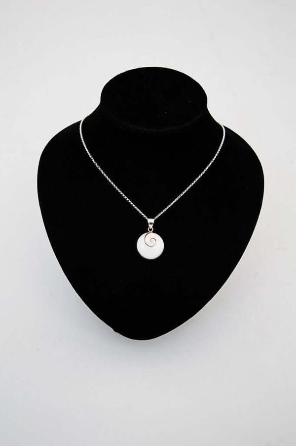 Sterling silver Shiva Eye pendant necklace displayed on a black jewelry stand