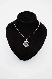 Sterling silver filigree vine necklace displayed on a black jewelry bust