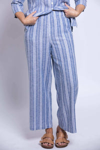 Parker Pant styled with matching blue striped shirt, front view with tan sandals