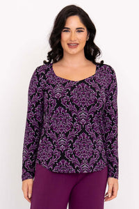 Front view of model wearing purple damask sweetheart-neckline bamboo top with long sleeves