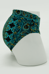 Side view of Teal Mosaic Bamboo Hipster underwear on a mannequin