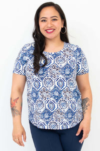 Front view of woman wearing Tessa Tee in blue mosaic print with short sleeves