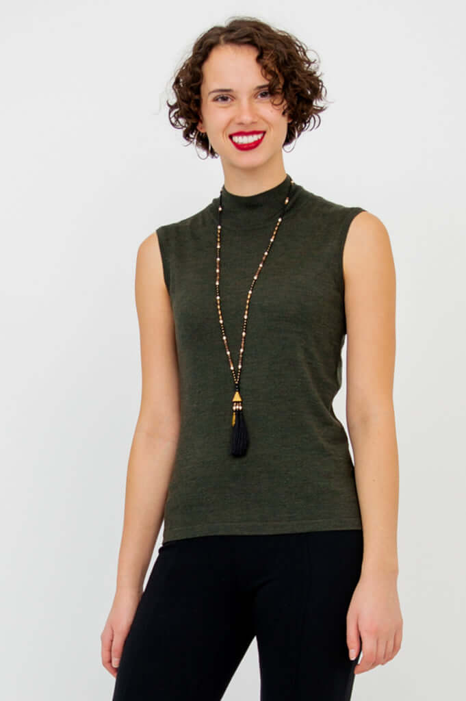 Three-quarter front view of the model in the Rita Merino Wool Sleeveless Sweater