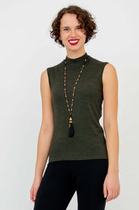 Three-quarter front view of the model in the Rita Merino Wool Sleeveless Sweater