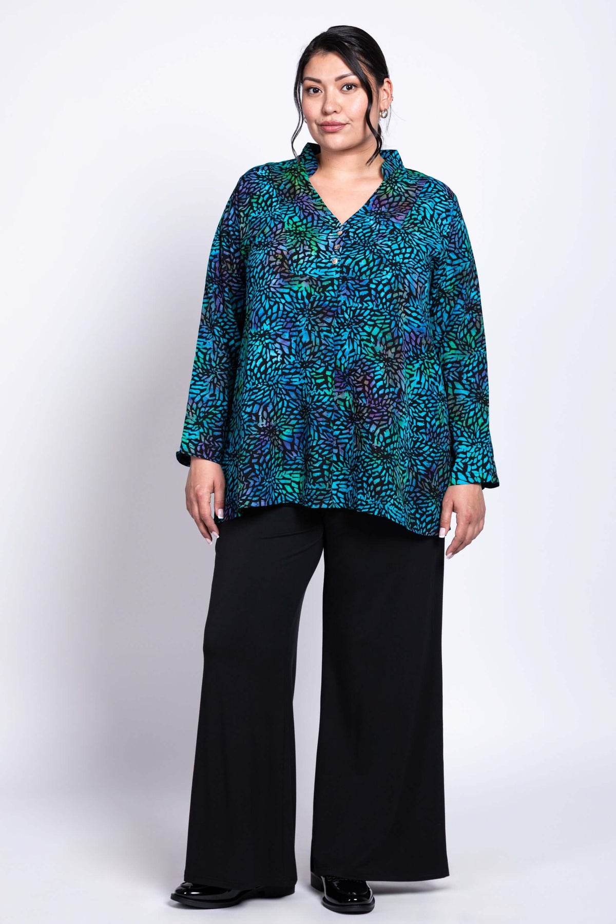 Three-quarter front view of Shirley Blouse styled with black pants