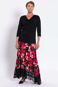 Three-quarter front view of Vera floral maxi skirt with vibrant red flowers