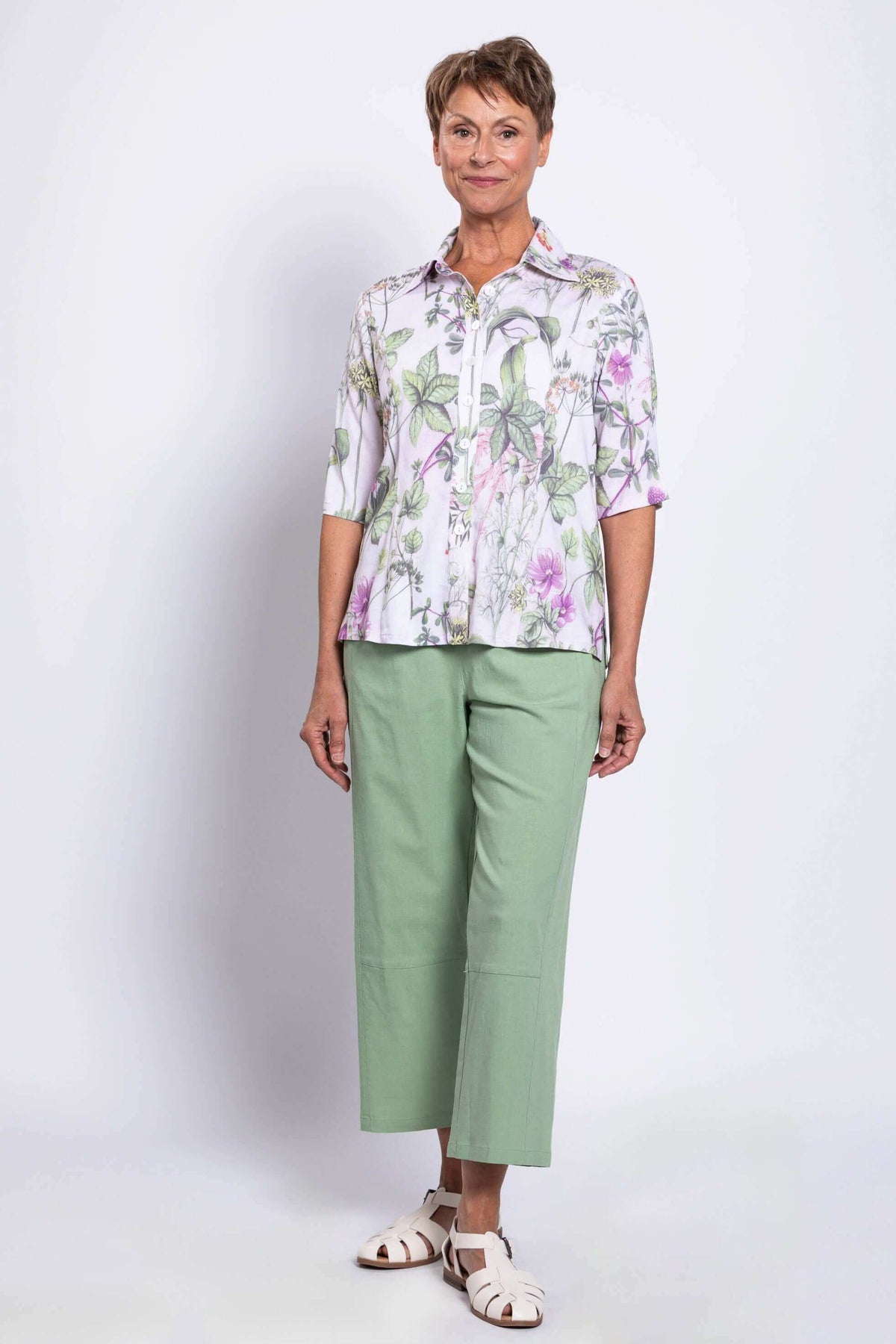 Three-quarter front view of model wearing Lorine botanical bamboo linen blouse