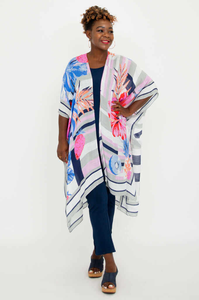 Three-quarter view of model wearing Darcy kimono wrap, vibrant floral details visible