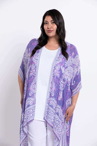 Three-quarter view of model in The Darcy Kimono Wrap with white outfit