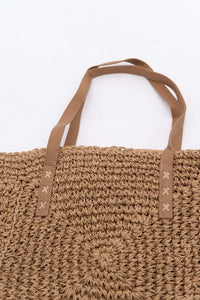 Top view of woven paper tote bag showing dual tan handles and stitching details
