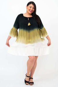 Model twirling in Ellie Dress, highlighting the movement of the flounce hem