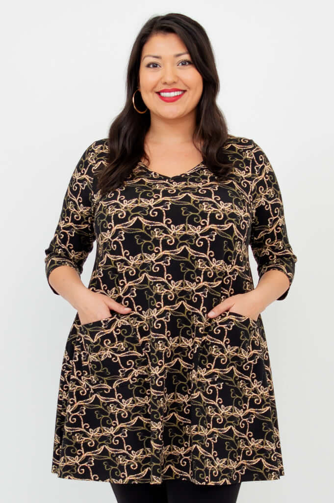 Model wearing Veronica A-Line Tunic with black vine pattern, hands in patch pockets