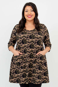 Model wearing Veronica A-Line Tunic with black vine pattern, hands in patch pockets