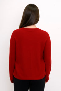Close-up back view of woman wearing relaxed fit red cashmere sweater
