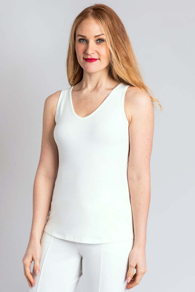 Woman modeling white bamboo tank, V-neck, angled front view