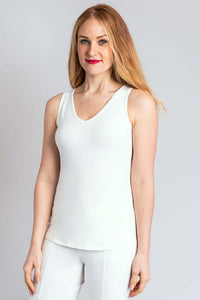 Woman modeling white bamboo tank, V-neck, angled front view