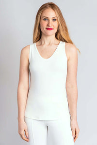 Woman wearing a white bamboo reversible tank with V-neckline, front view