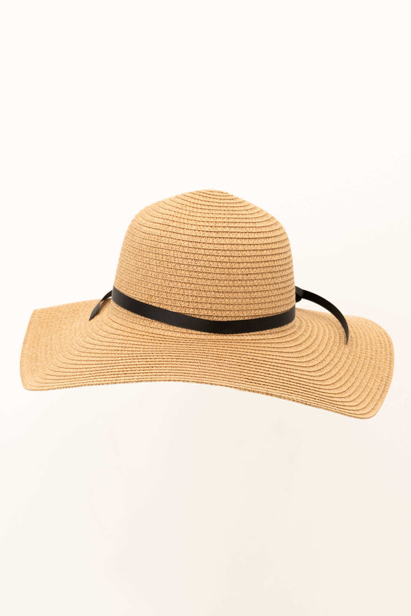 Wide brim straw floppy hat with black ribbon, front angle
