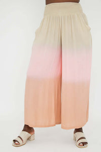Wide leg ombre pants in beige and peach with pockets, front view