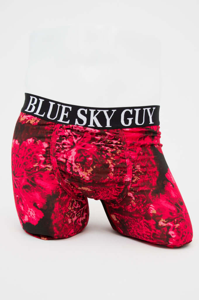 Front view of men's boxer briefs with vibrant red floral pattern and 'BLUE SKY GUY' waistband