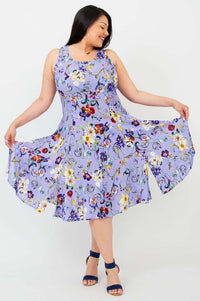 Woman showing off the flared skirt of a lilac floral A-line dress
