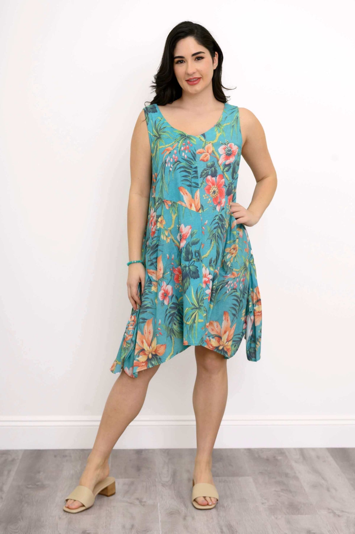 Woman in Gia Dress posing with hand on hip, showing floral design