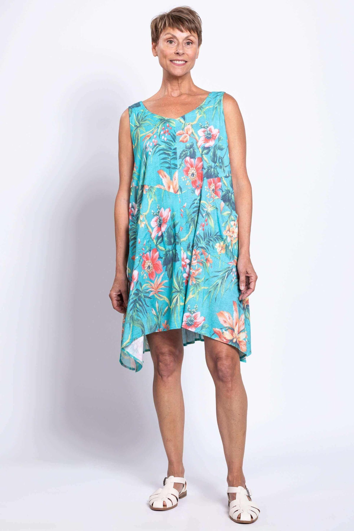 Woman in Gia Dress showing floral print and uneven hem from the front