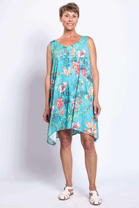 Woman in Gia Dress showing floral print and uneven hem from the front