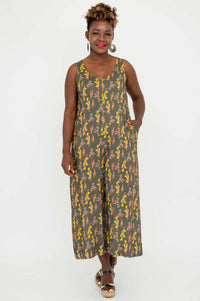 Model standing in a sleeveless floral jumpsuit, hands in pockets