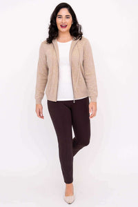 Woman smiling in beige zip hoodie, walking forward, full body front view