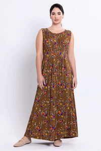 Woman modeling a sleeveless brown floral maxi dress, full front view