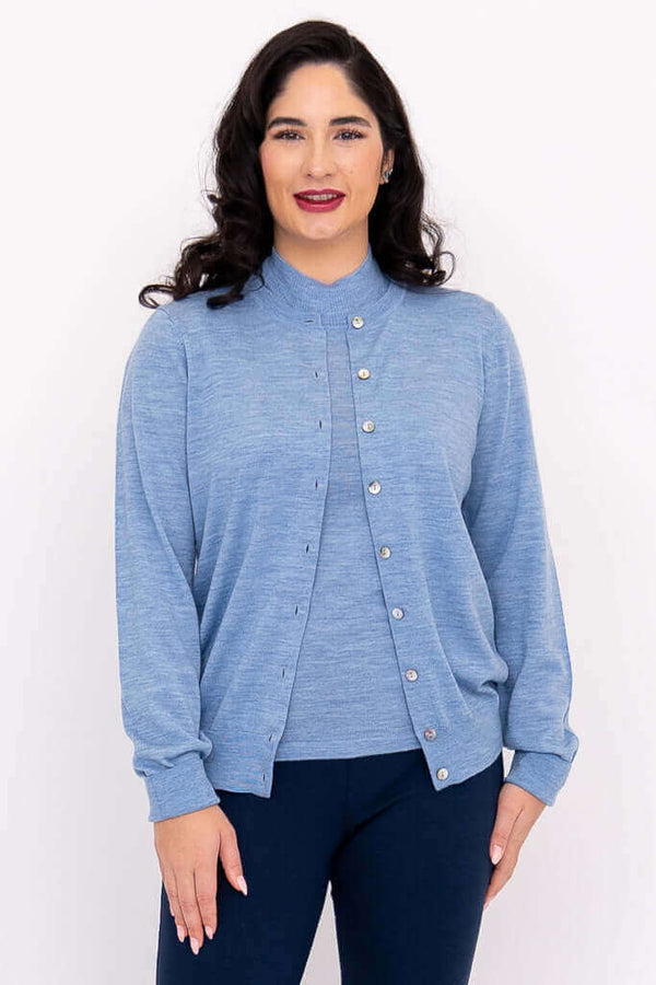 Woman modeling a light blue button-up crew neck cardigan with ribbed cuffs