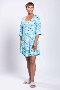 Woman modeling blue bamboo sleepshirt, standing with arms relaxed, front view