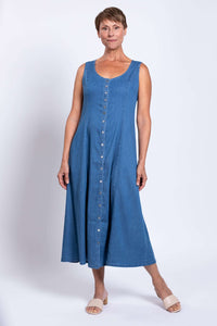 Woman wearing a blue Tencel denim maxi dress with full front buttons
