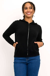 Woman in black zip-front wool-cashmere hoodie with hands in front pockets
