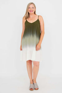 Woman standing straight in olive ombre mini dress, front view, smiling