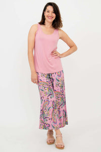 Woman wearing pink paisley Landon capri pants and sleeveless pink top