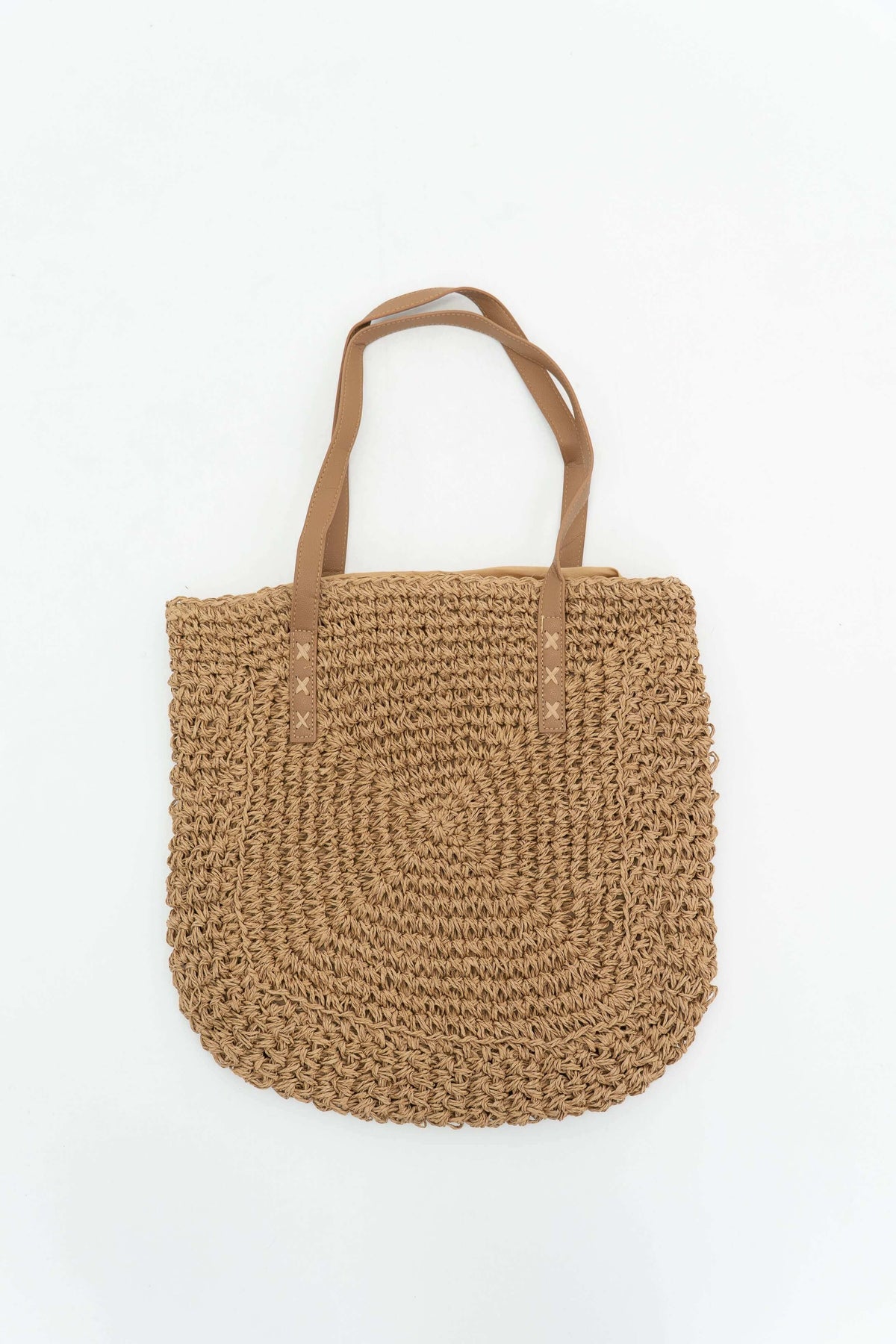 Spacious woven paper tote bag with dual tan handles on white background