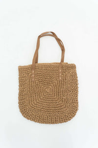 Spacious woven paper tote bag with dual tan handles on white background