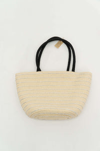 Woven tote bag with metallic silver stripes and black handles on white background