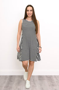 Woman posing in a casual black and white striped A-line bamboo dress with a round neckline.