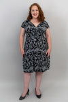 A black-and-white v-neck dress made with natural bamboo fibre featured on a plus-size model.